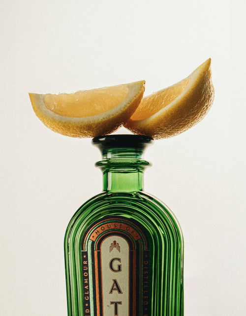 Close-up of lemon wedges resting on the Gatsby Gin bottle stopper